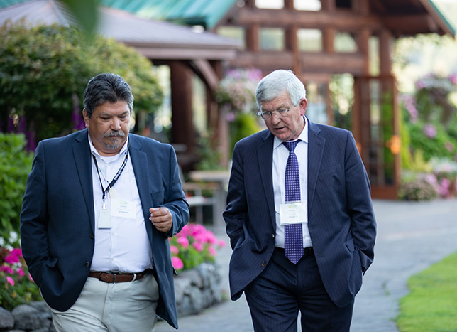 two men walking together.